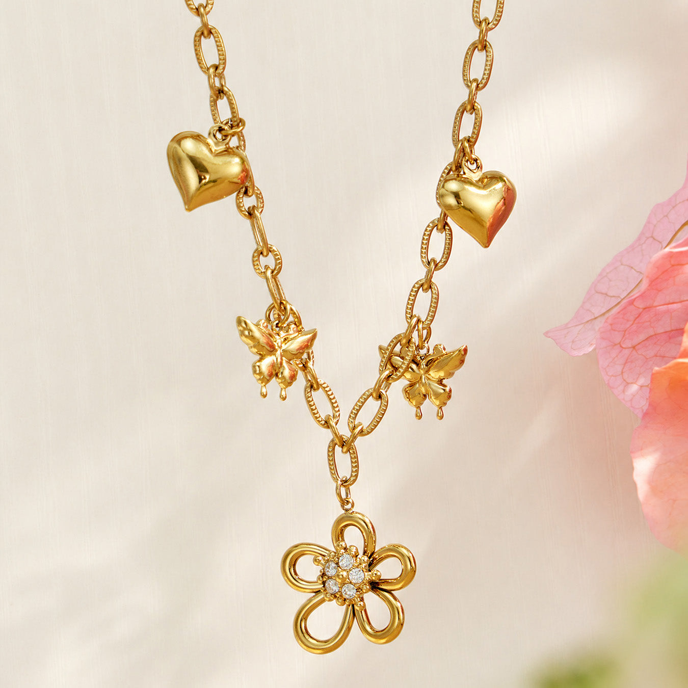 18K PVD gold floral butterfly charm necklace with heart and zircon flower details