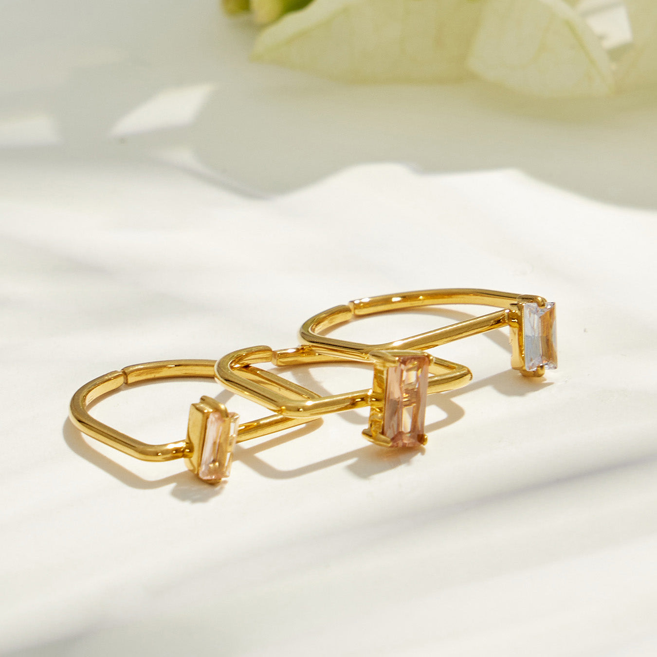 Side view of a 316L stainless steel multi-band gold ring showing the layered band structure