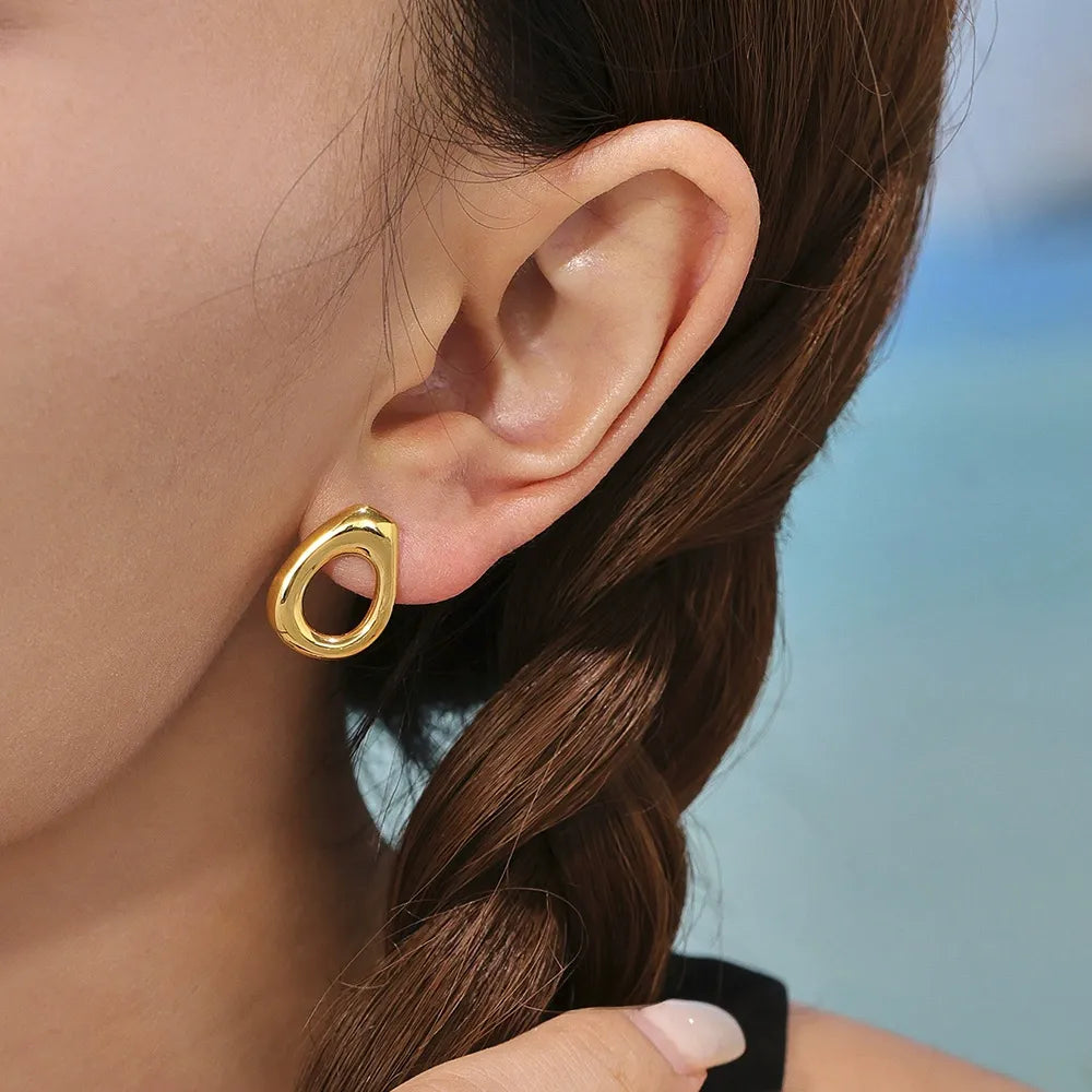 Model showcasing tarnish-free 316L stainless steel natural stone beaded hoop hypoallergenic earrings.