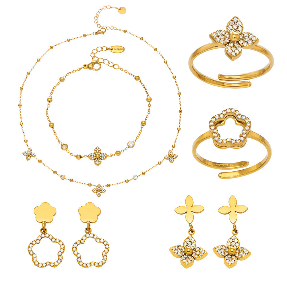 A complete 316L stainless steel jewelry collection featuring flower zircon and geometric designs in 18K gold plating.