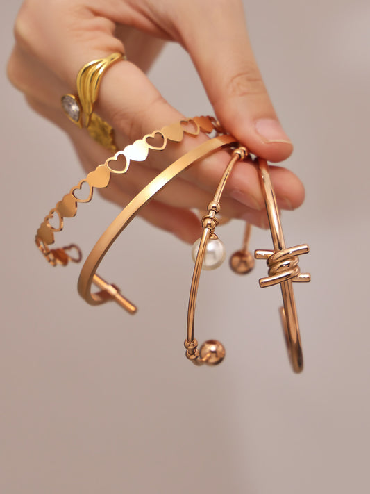 316L Stainless Steel 18K Gold PVD Interlocking Heart Hollow Geometric Bangle - Interlocking Heart, Hollow Design, Geometric, Minimalist, Modern Bangle Wholesale Stainless Steel Jewelry - Sensitive Skin Friendly - Detail 1