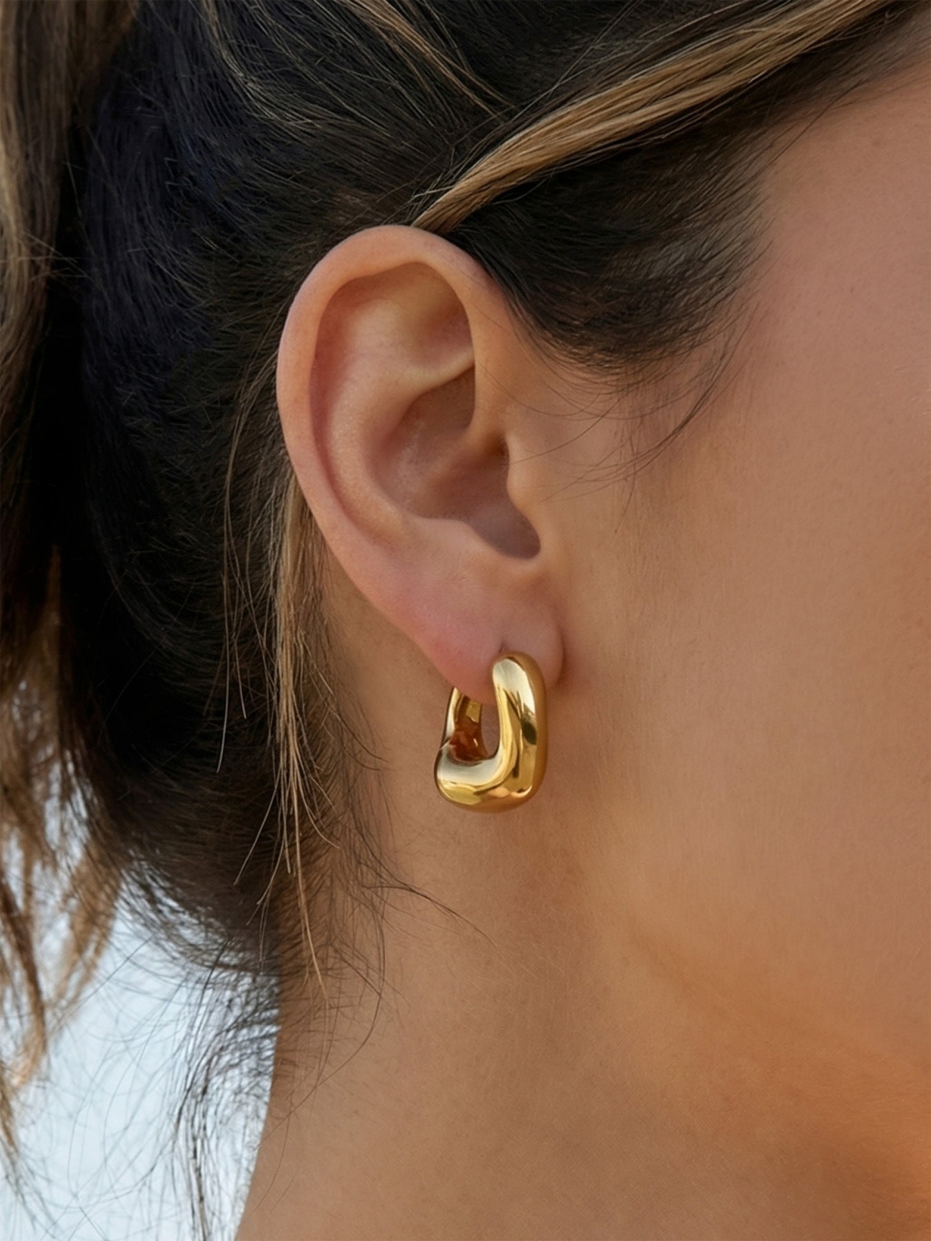 316L stainless steel 18K Gold PVD Oval Huggie Hoop Earrings modeled styling view for wholesale earrings buyers