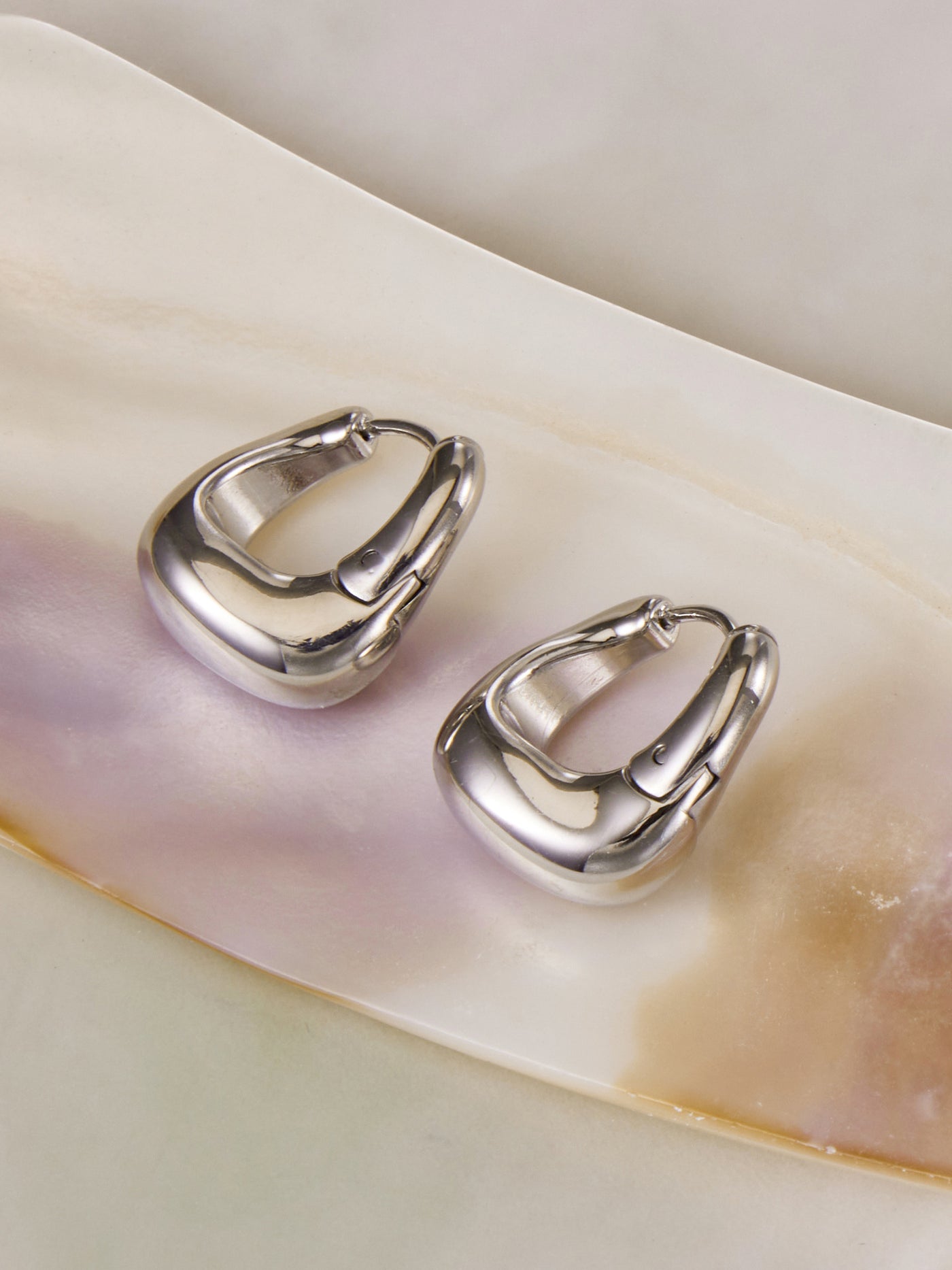 316L stainless steel 18K Gold PVD Oval Huggie Hoop Earrings close-up detail view for wholesale earrings buyers