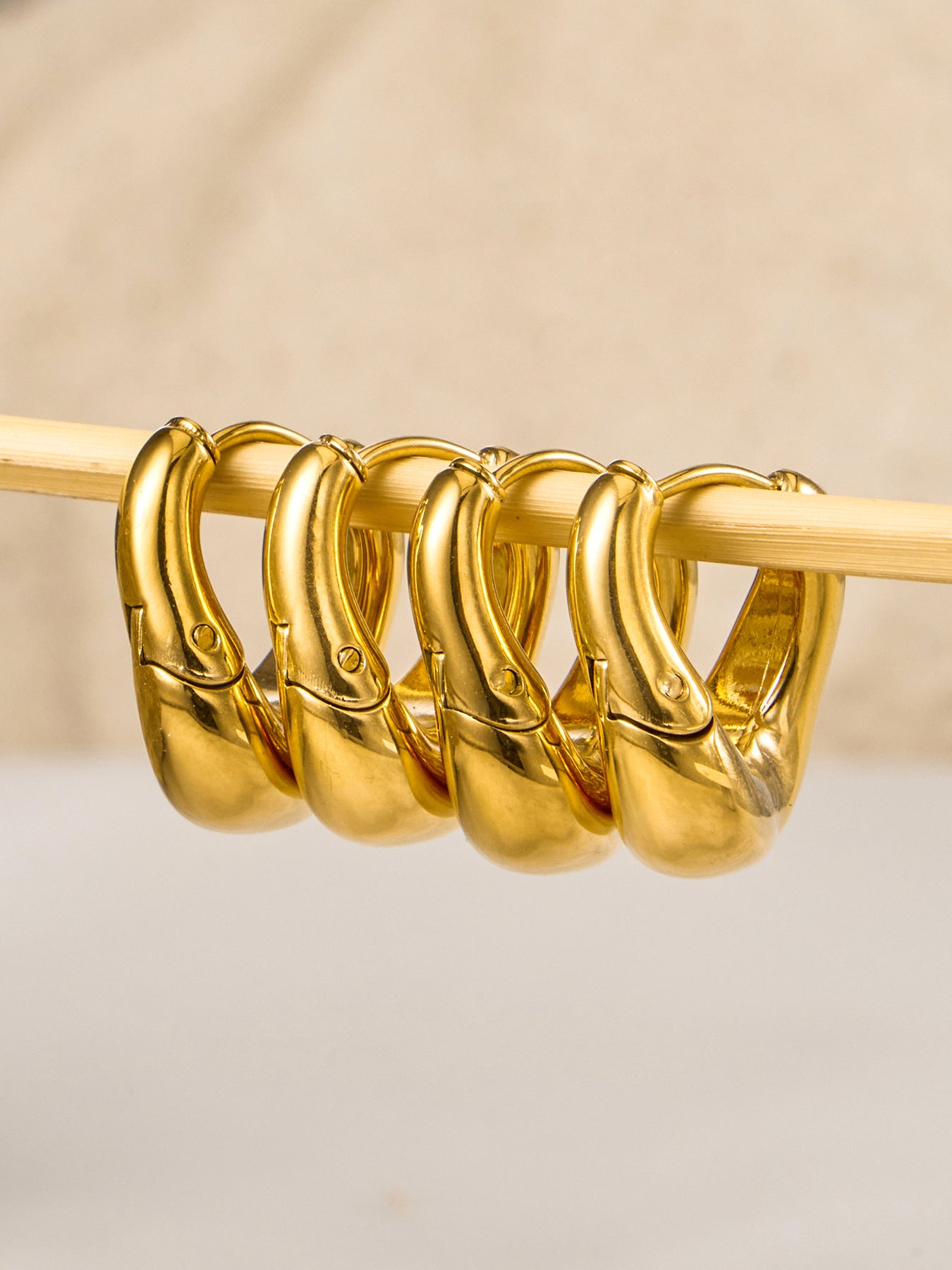 316L stainless steel 18K Gold PVD Oval Huggie Hoop Earrings color option display for wholesale earrings buyers