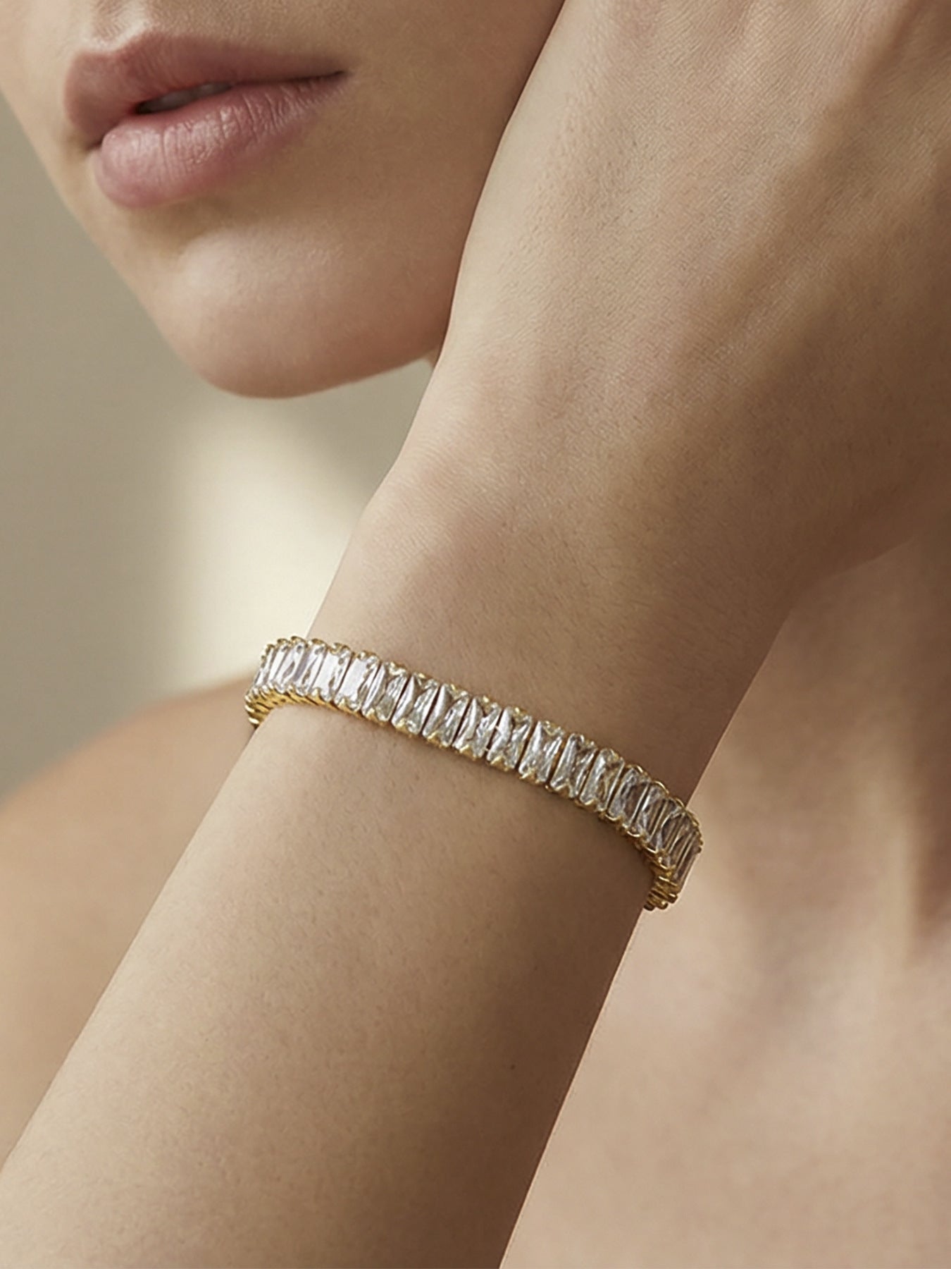 Model wearing 316L stainless steel 18K gold PVD 5A zircon lock link bracelet, stacked with thin chains, waterproof everyday wear