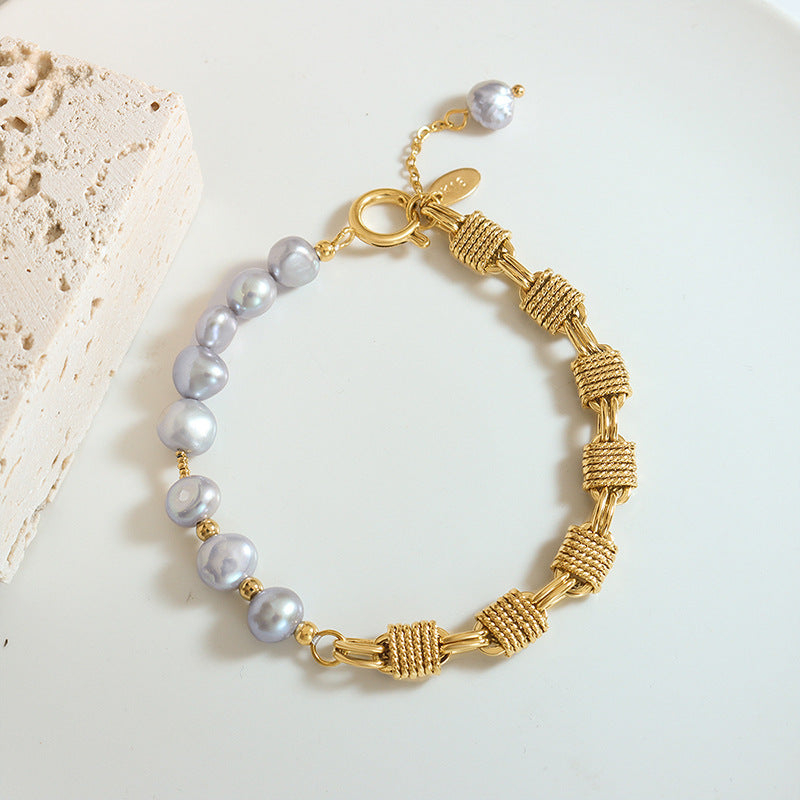 Grey freshwater pearl bracelet flat lay with gold plated copper details for wholesale bracelet assortments