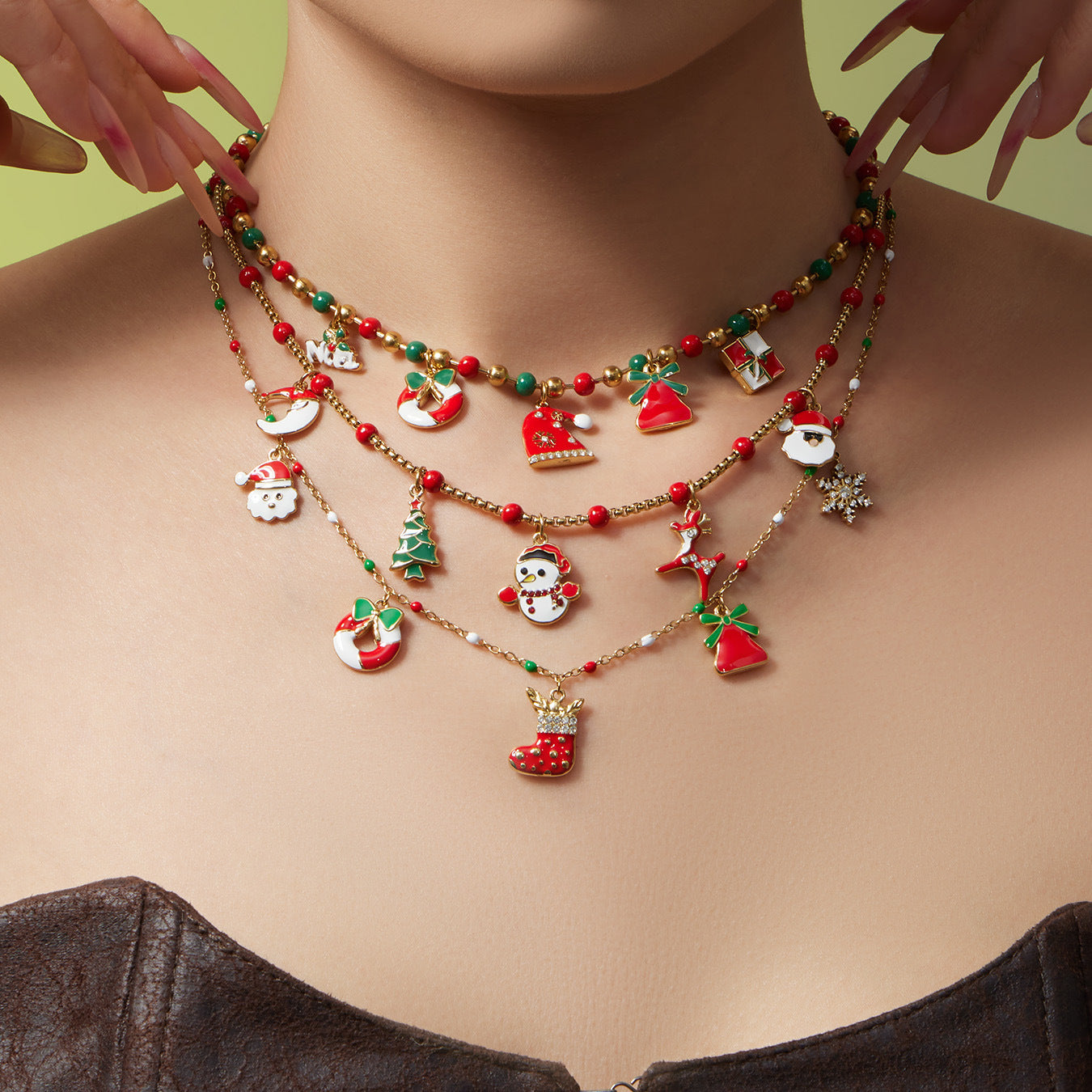 Model wearing 316L stainless steel Christmas charm beaded necklace, enamel holiday charms