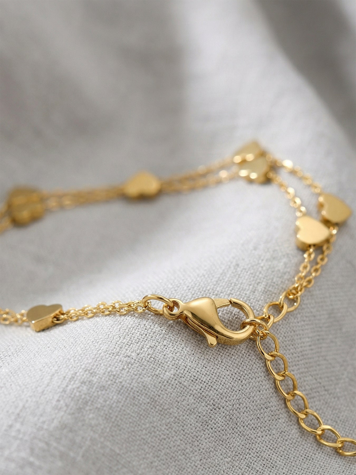 Close-up of 316L stainless steel double layer heart chain bracelet, 18K PVD gold plating tarnish-free