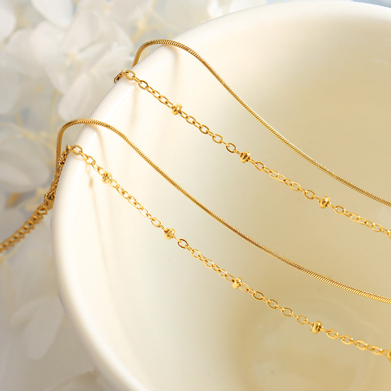 Detailed view of 18K PVD gold plated snake chain bracelet