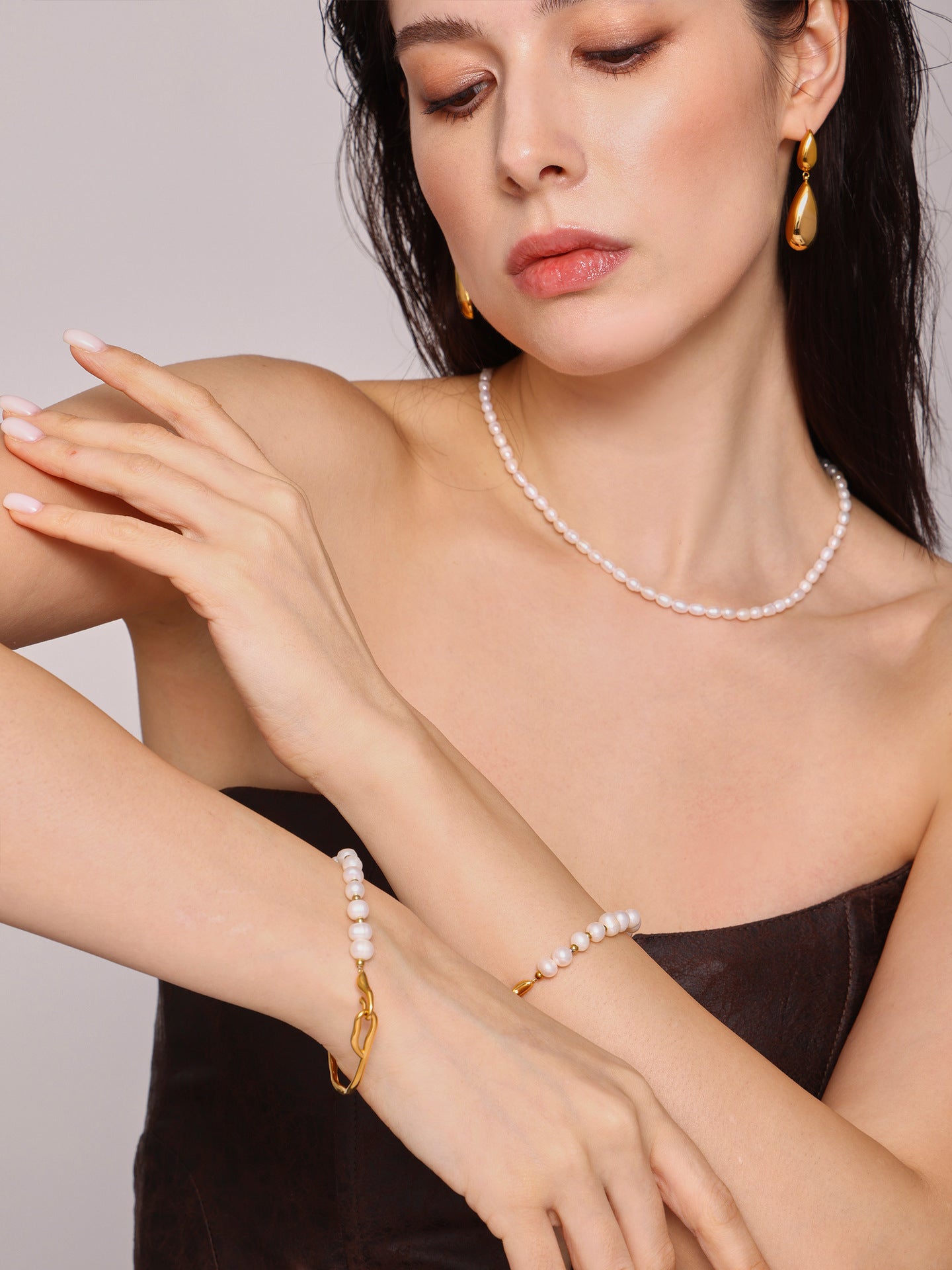 316L Stainless Steel pearl bracelet wrist close-up, hypoallergenic for sensitive skin