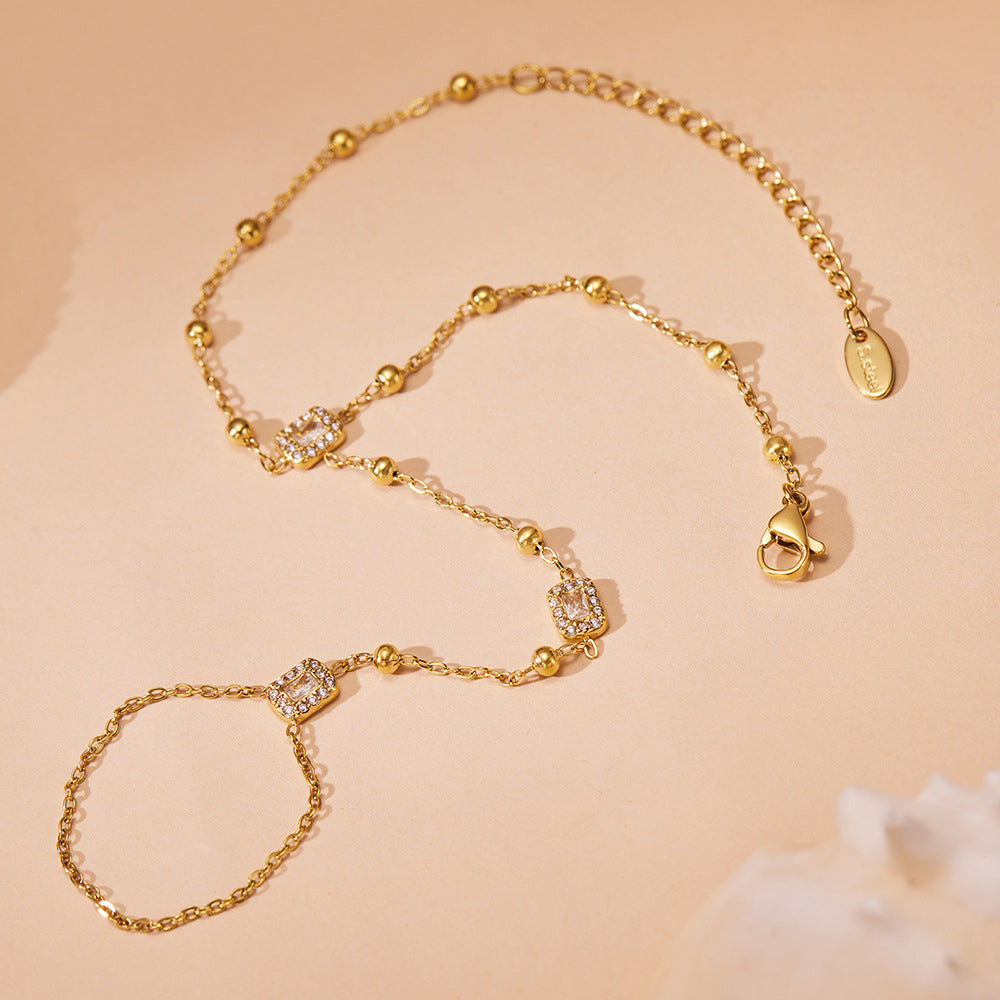 Close-up of 18K PVD gold finish on stainless steel bracelet