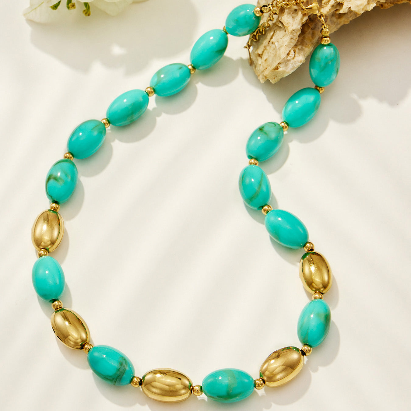 Elegant green resin necklace paired with matching bracelet