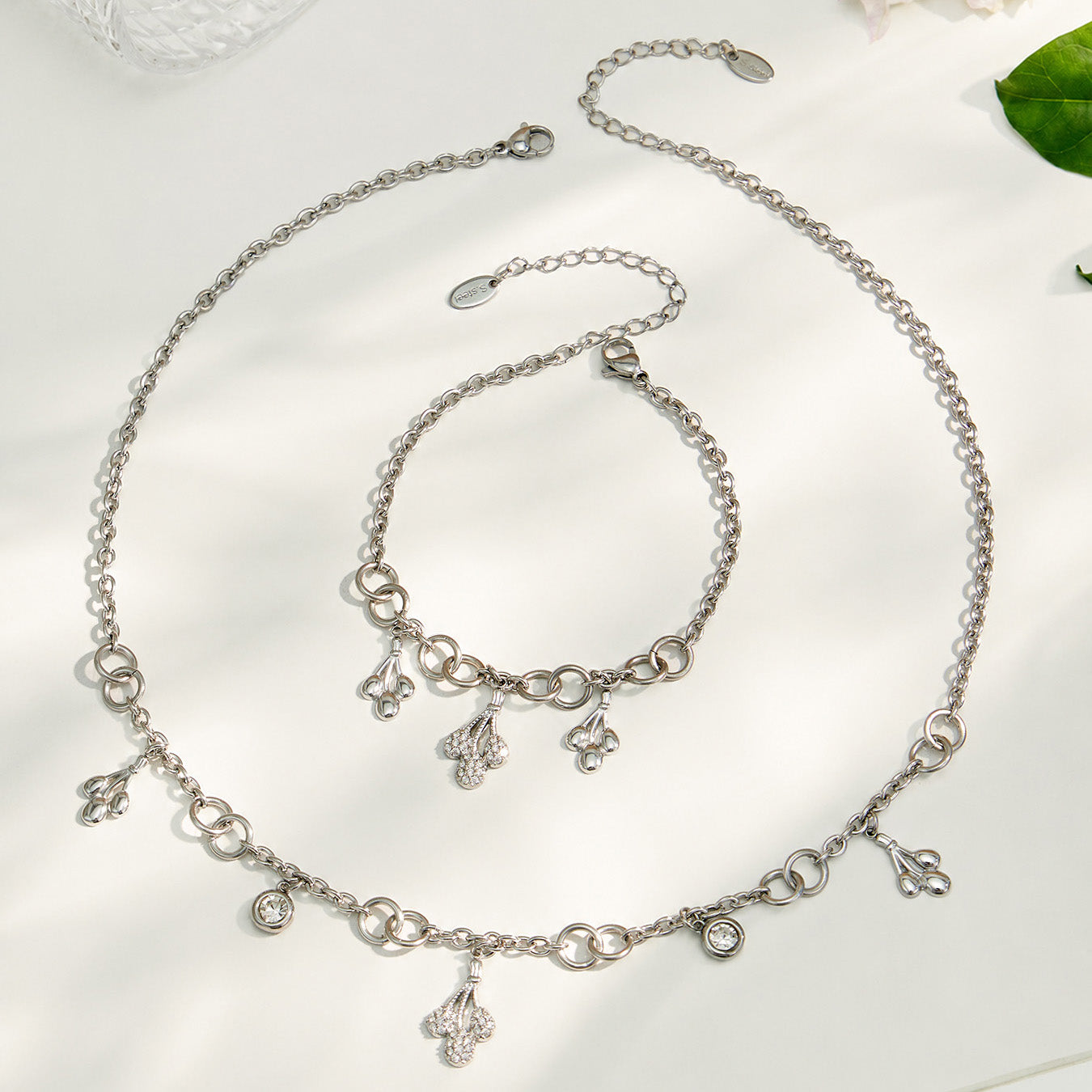 Polished steel teardrop zircon necklace and matching bracelet in 316L stainless steel