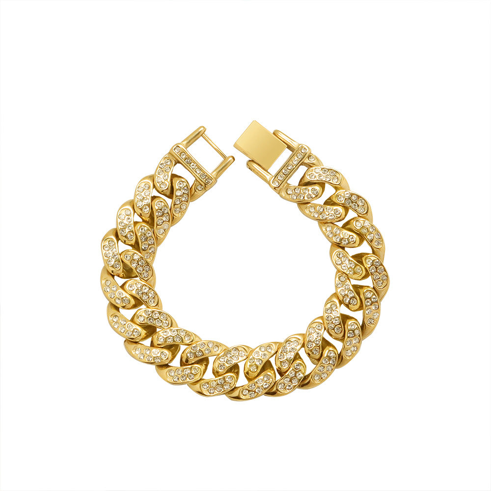 Chunky gold-tone Cuban link bracelet with clear cubic zirconia on bold interlocking links