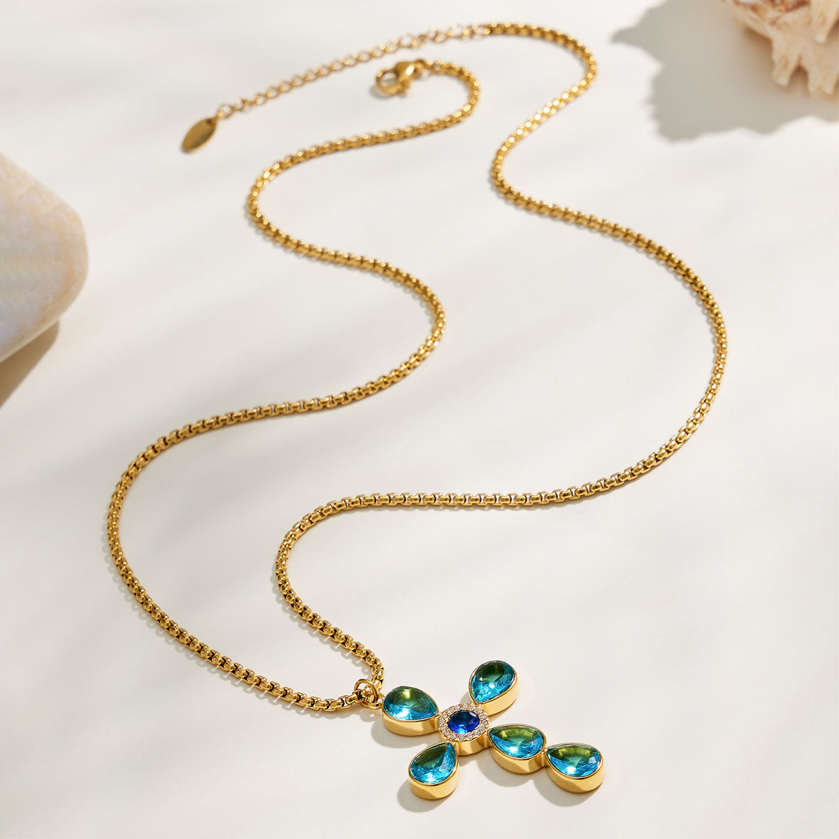 Colorful stone-set cross necklace with polished chain detail