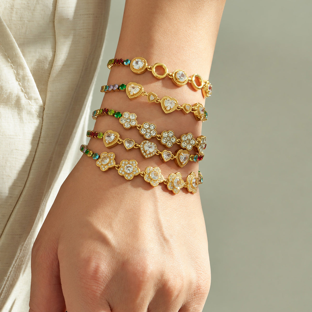 Colorful zircon bracelets layered on wrist