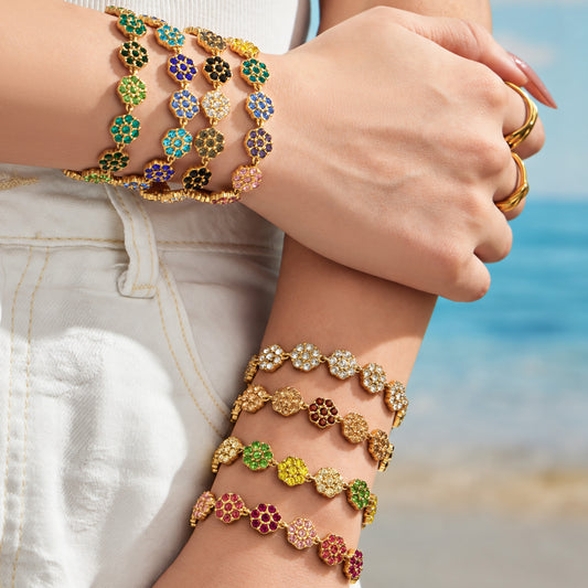 Colorful zircon flower bracelets stacked on wrist