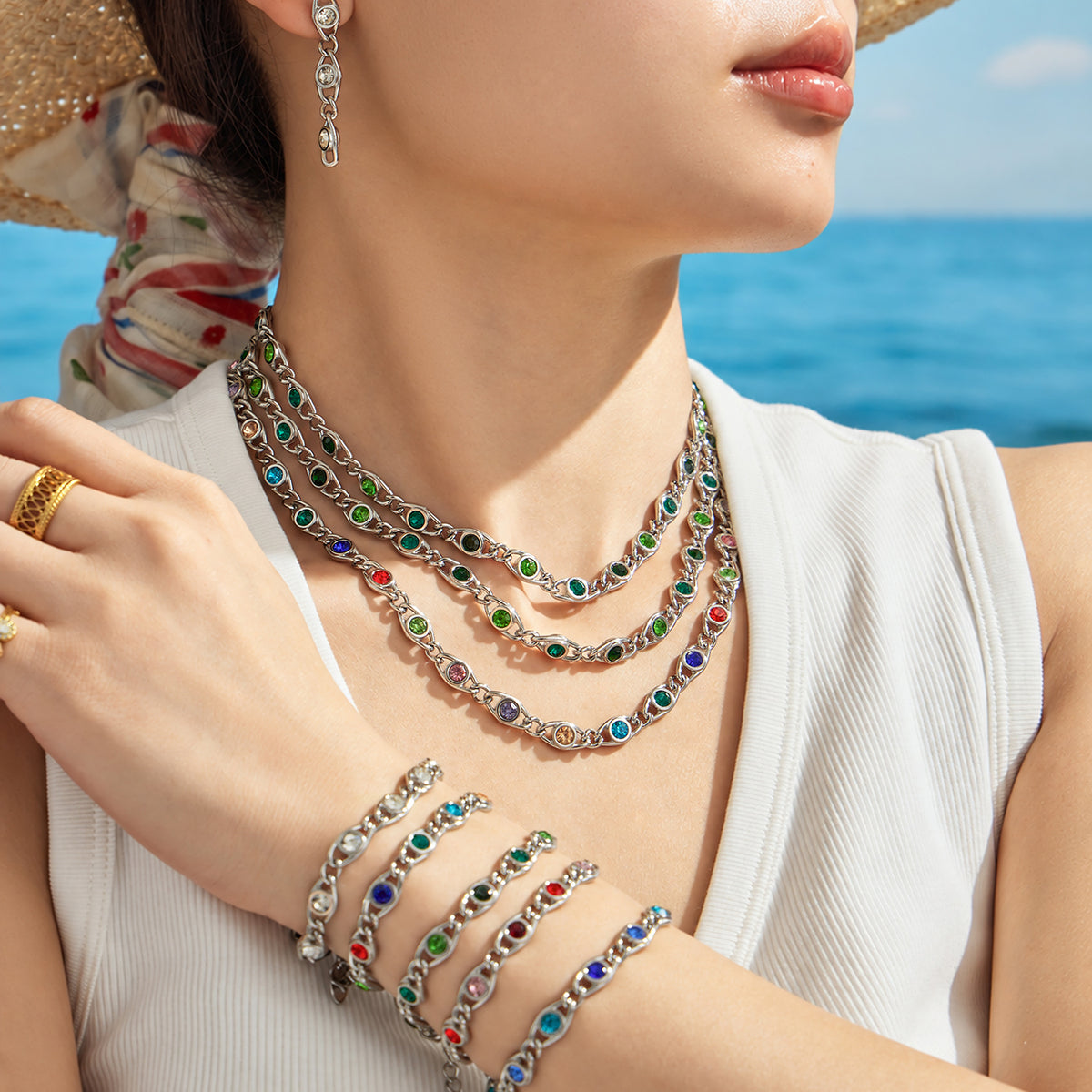 Colorful zircon necklaces and bracelets layered together