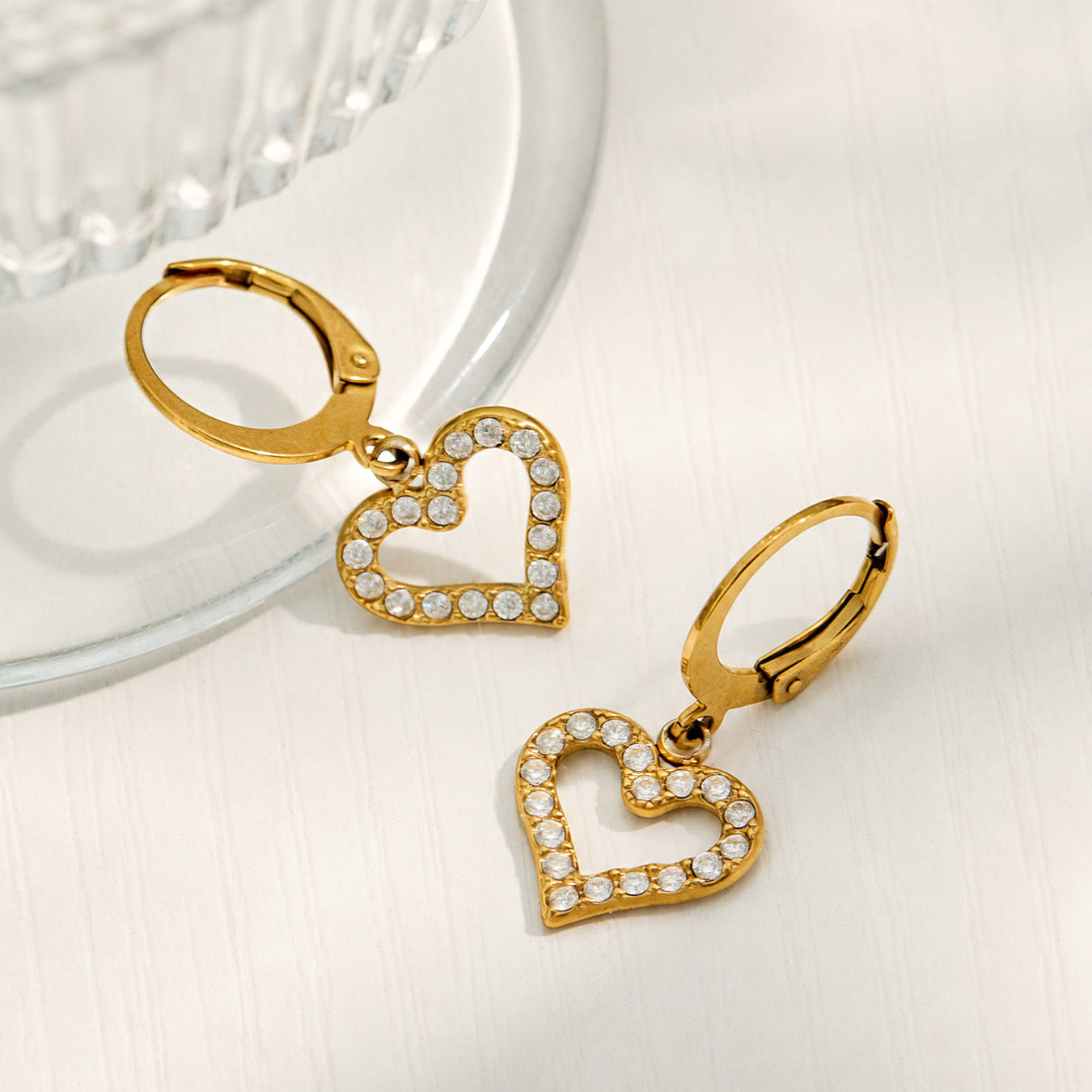 Double heart drop earrings with clear cubic zirconia and polished gold finish