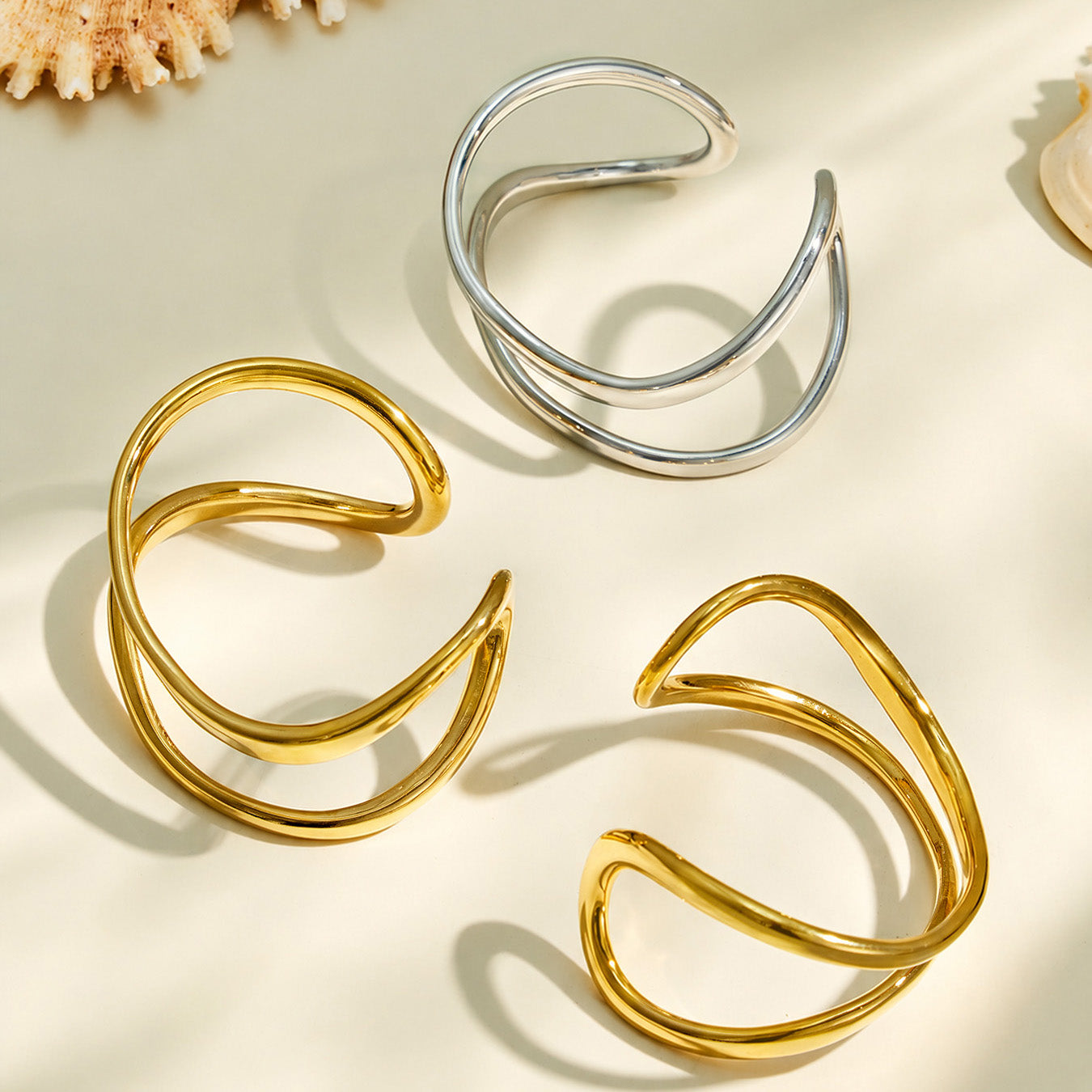 Gold and steel finish options for the double loop cuff bracelet