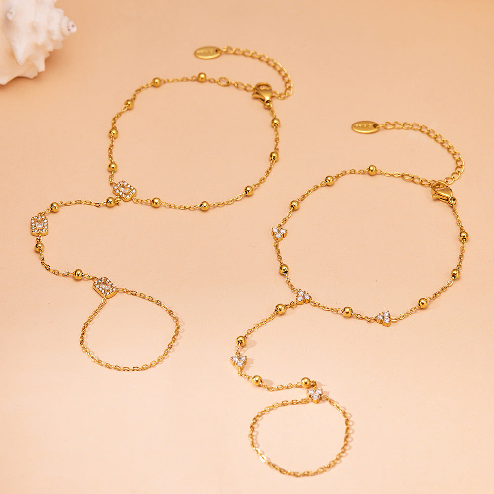 E550 and E551 gold zircon hand chain bracelets in floral and geometric designs