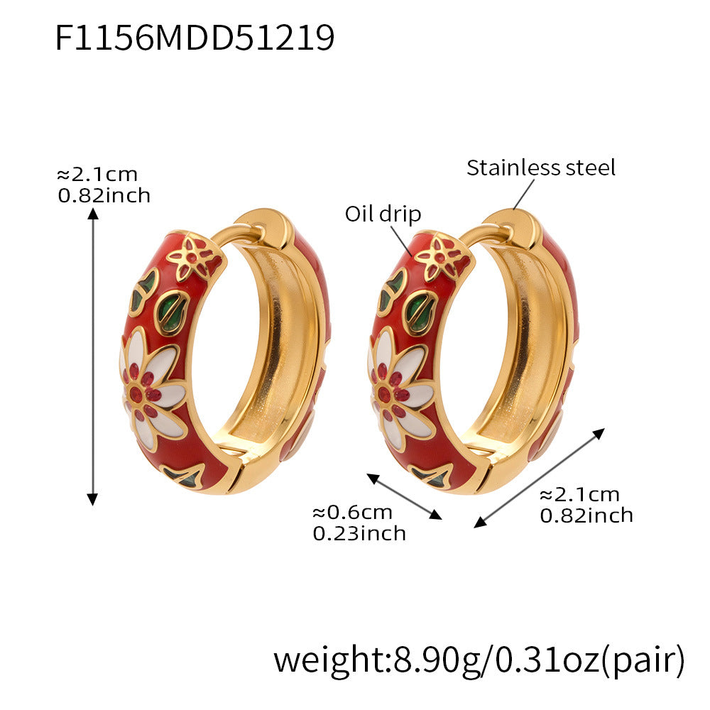 Red enamel floral hoop earrings in stainless steel, approx 2.1cm diameter, 0.6cm width, 8.9g per pair.