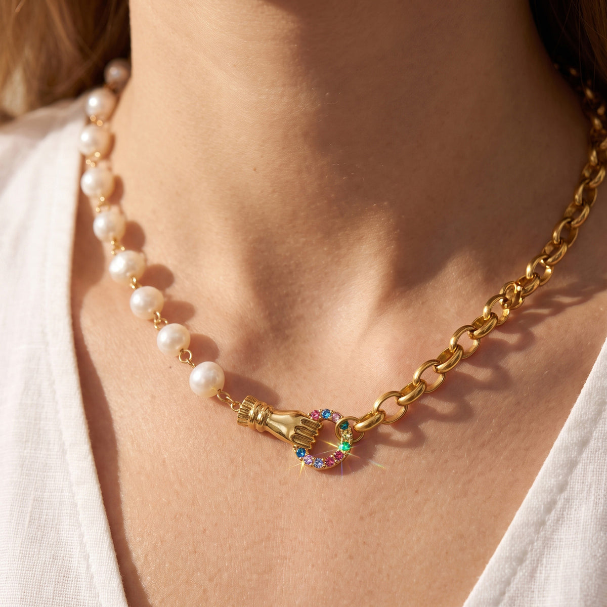 Freshwater pearl and gold chain necklace with multicolor zircon detail worn on model