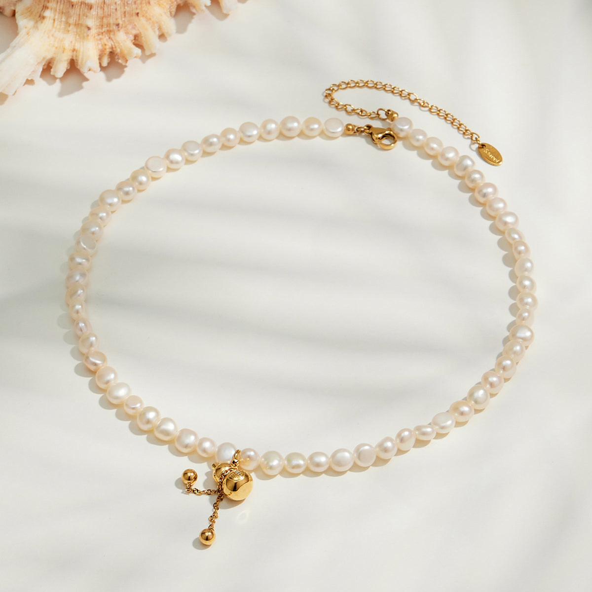 Freshwater pearl gourd pendant necklace flat lay