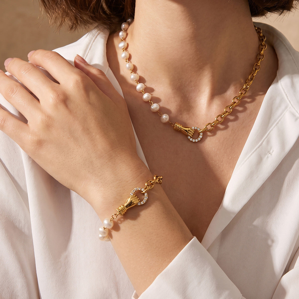 Freshwater pearl necklace and bracelet styled together with white zircon accents