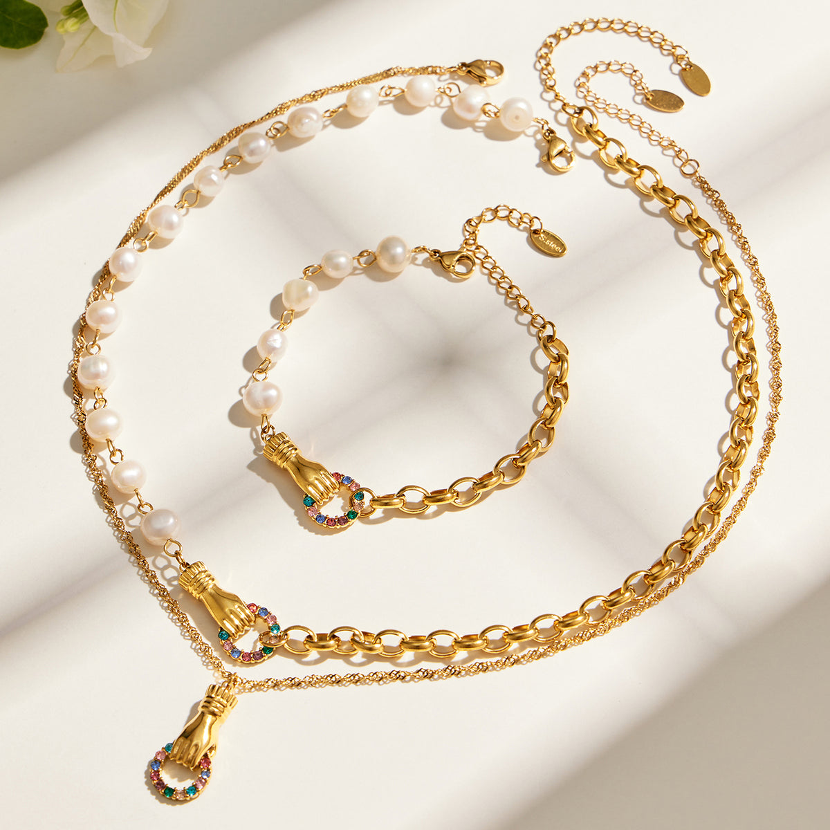 Freshwater pearl necklace and bracelet with gold chain and multicolor zircon details