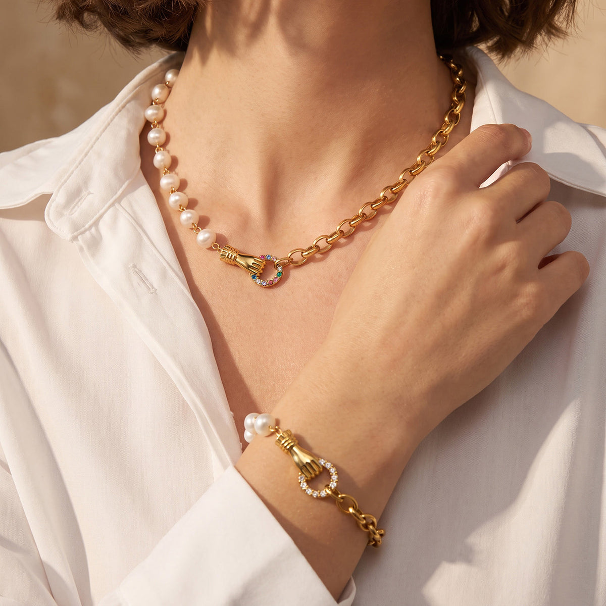 Matching freshwater pearl necklace and bracelet with gold chain and zircon accents