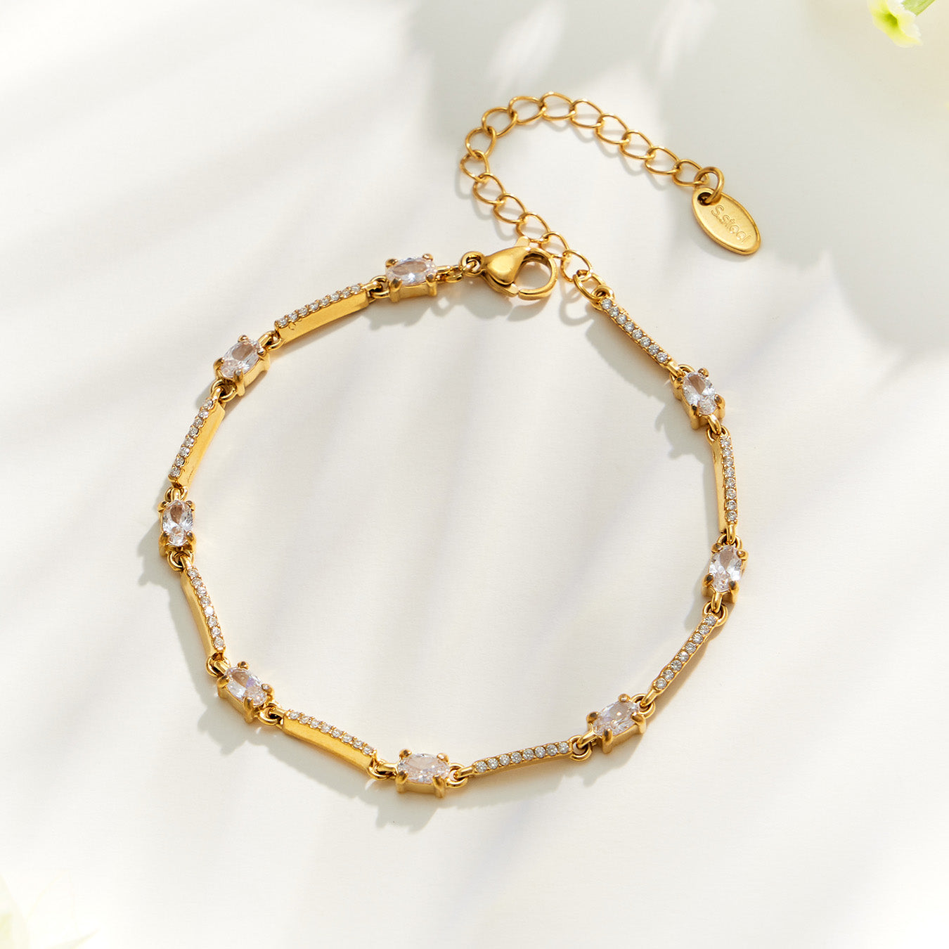 Gold teardrop zircon bracelet with delicate stone-set details and adjustable extension chain