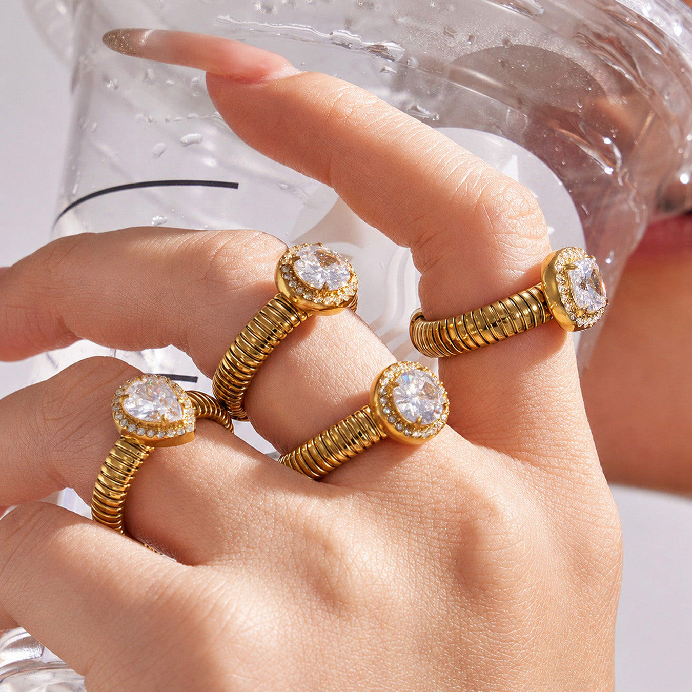 Model wearing gold geometric zircon open rings with waterdrop, round and square 5A zircon designs