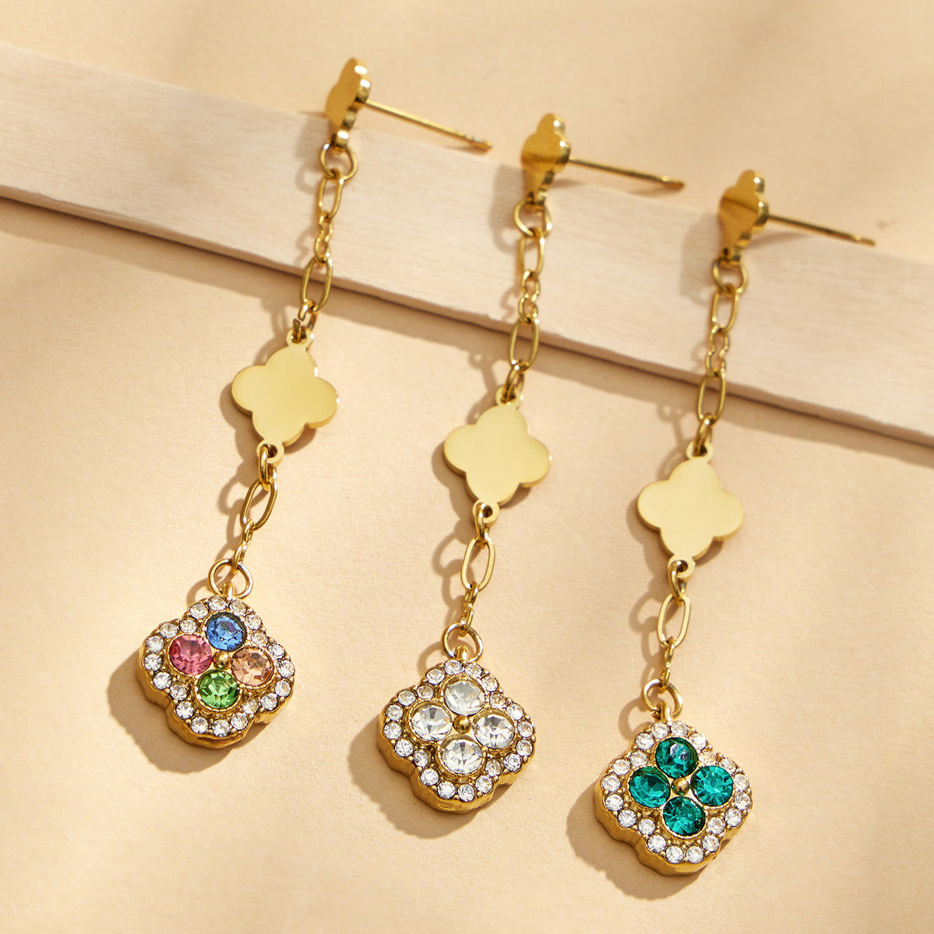 Gold clover crystal drop earrings in multicolor, white and green styles