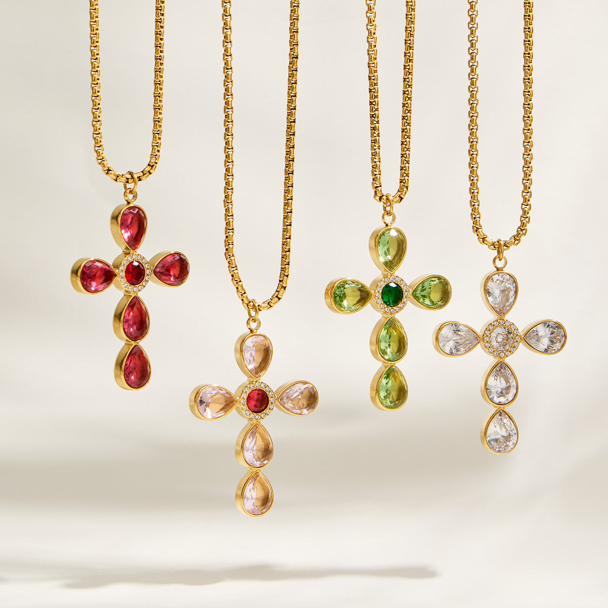 Gold-tone cross necklaces in multiple colorful stone options