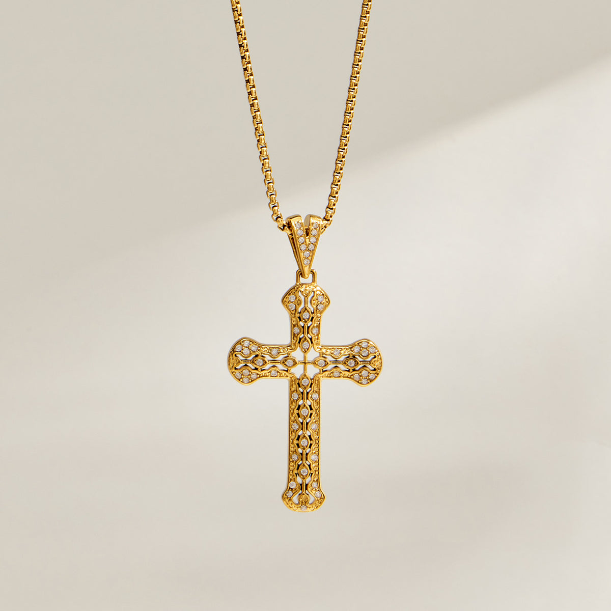 Gold zircon cross pendant necklace close-up