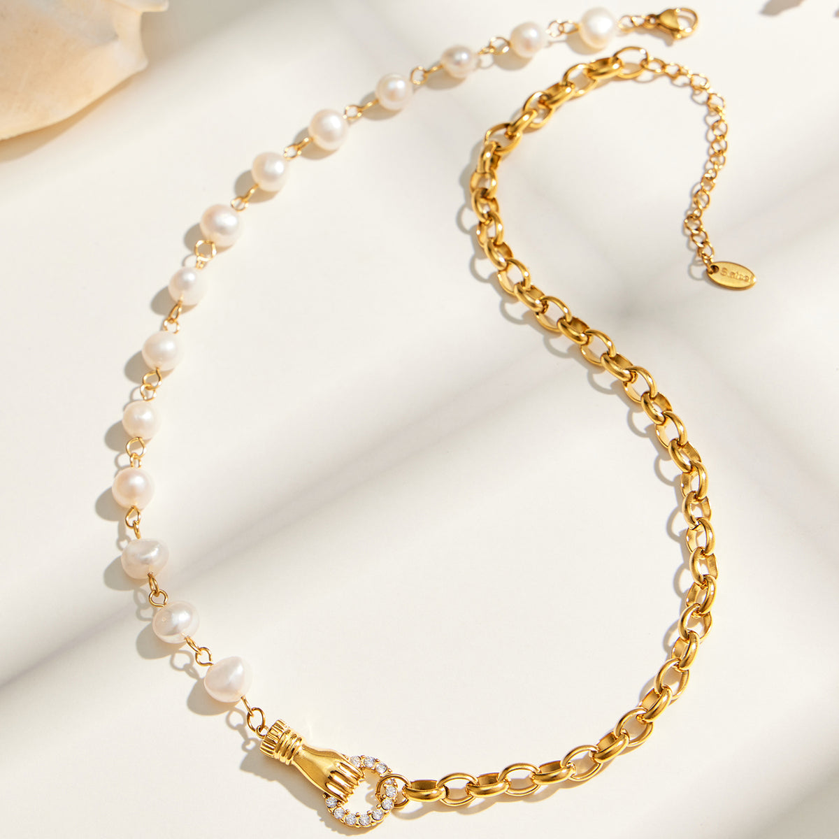 Half freshwater pearl half gold chain necklace with white zircon connector detail