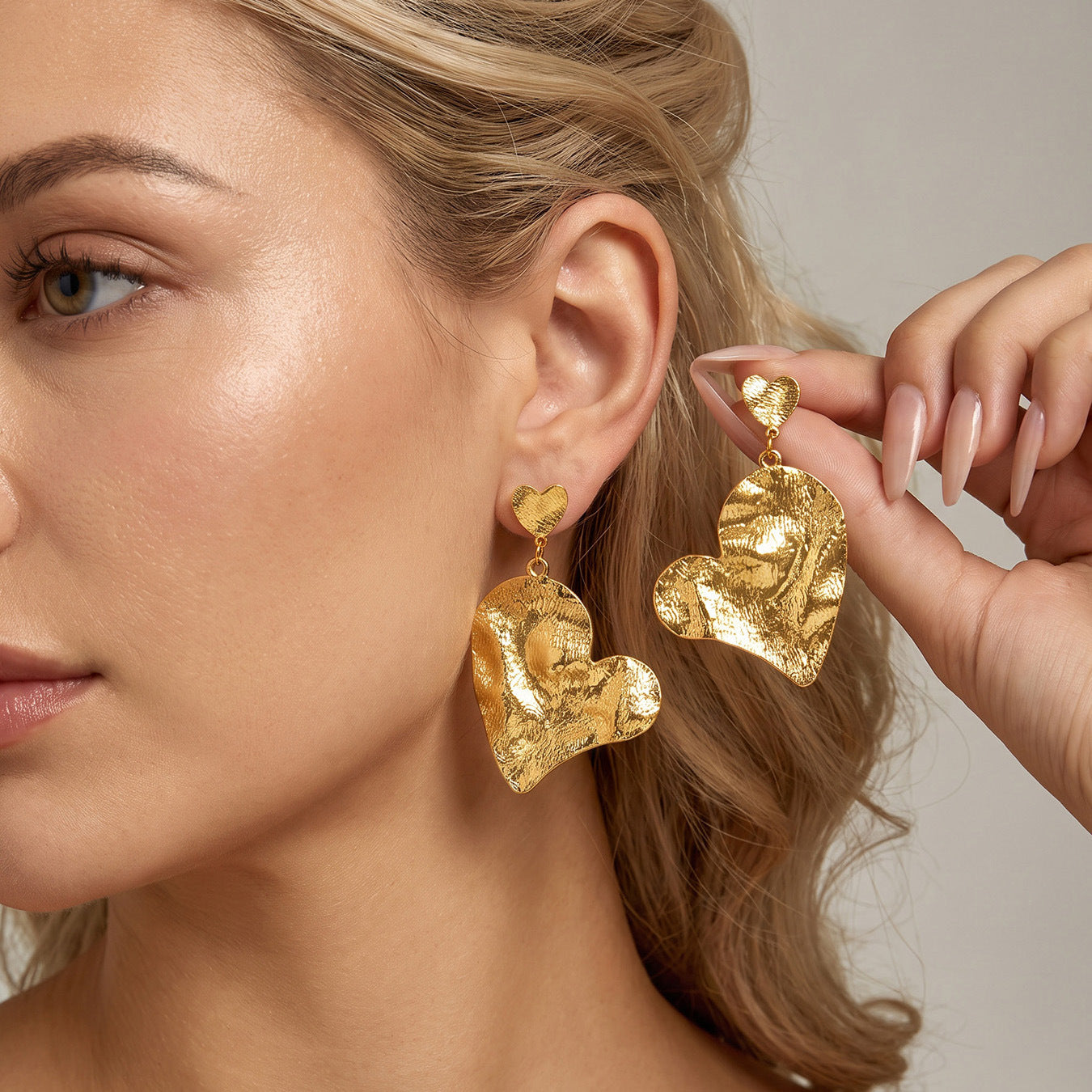 Model wearing Hammered Heart Gold Color Earrings