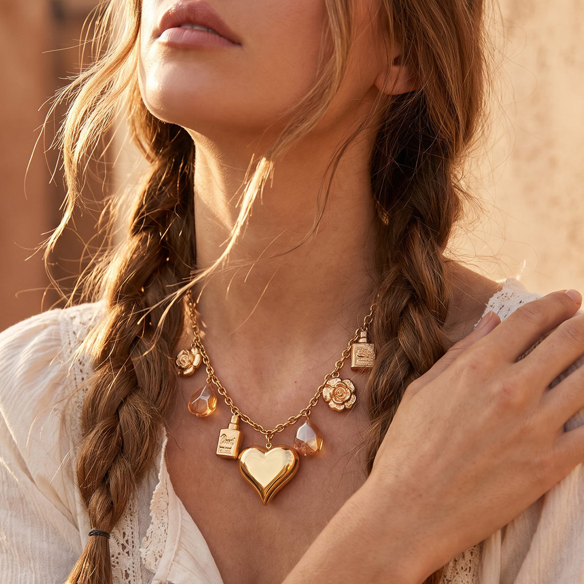 Heart and resin multi-charm necklace worn at the collarbone