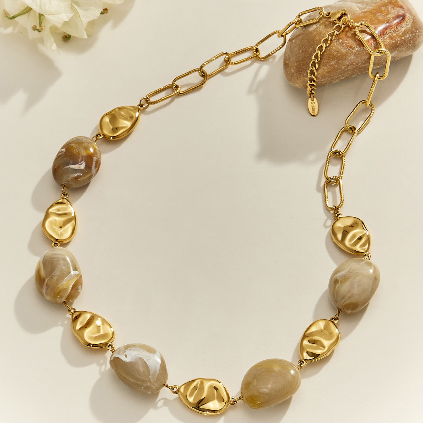 Irregular resin bead necklace with organic pebble shapes and polished 18K PVD gold stainless steel links