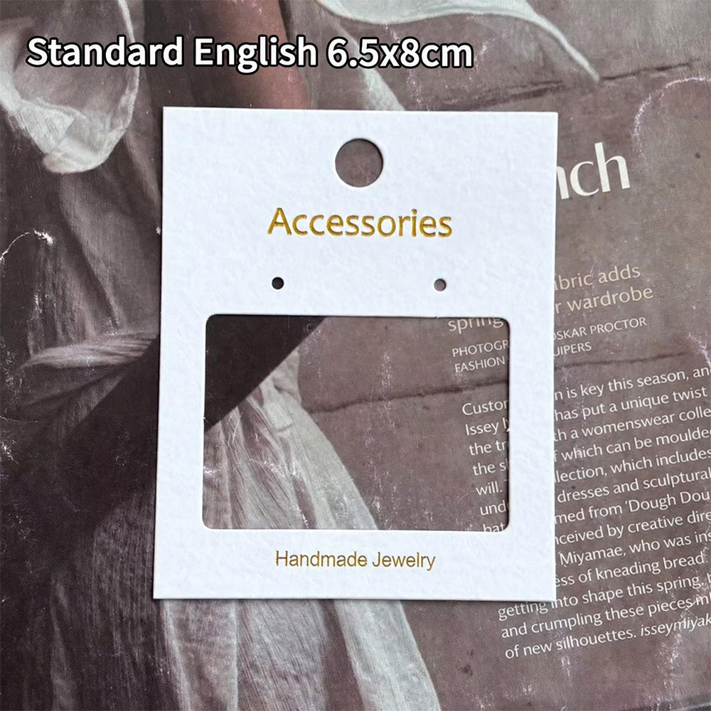 White accessories display card measuring 6.5 × 8 cm with cutout window