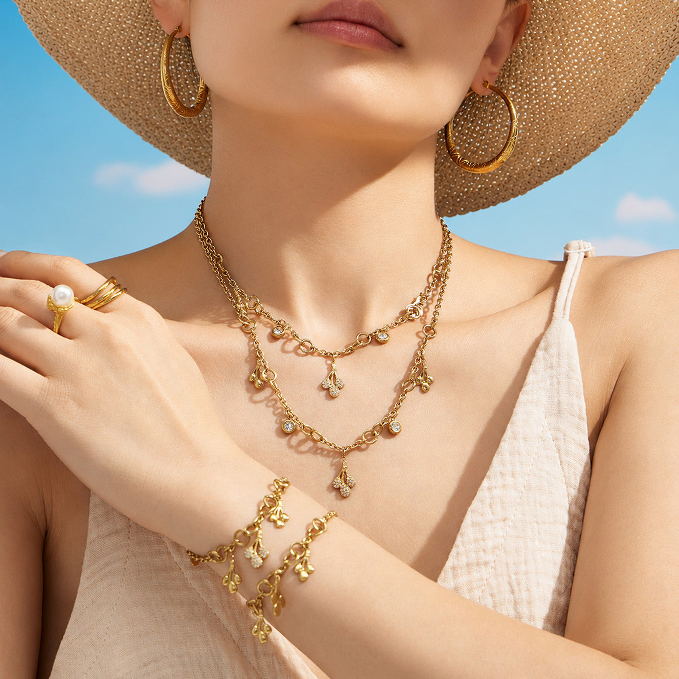 Matching teardrop zircon necklace and bracelet shown together on a model