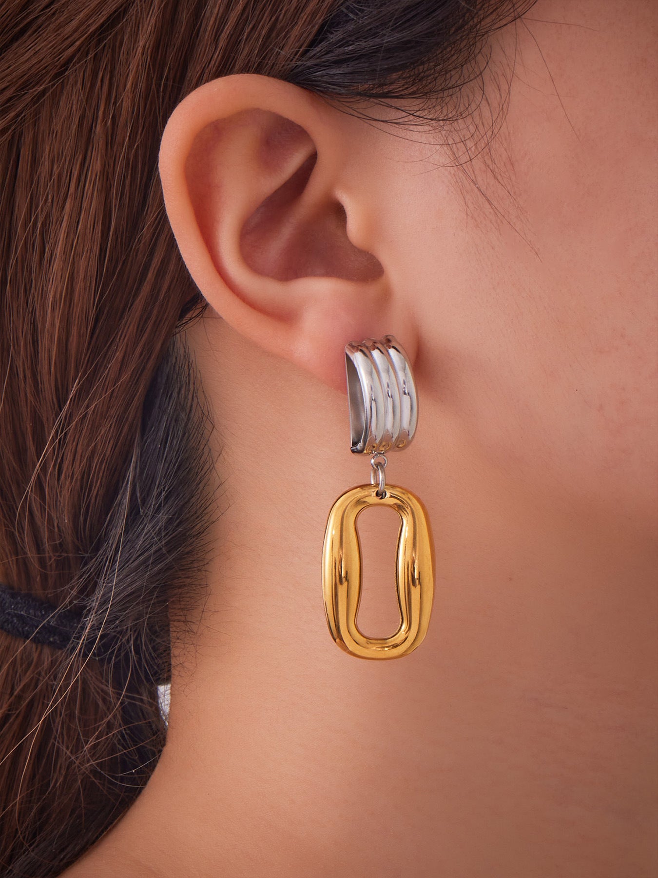 Miduoduo two-tone hollow rectangle door knocker earrings worn by model