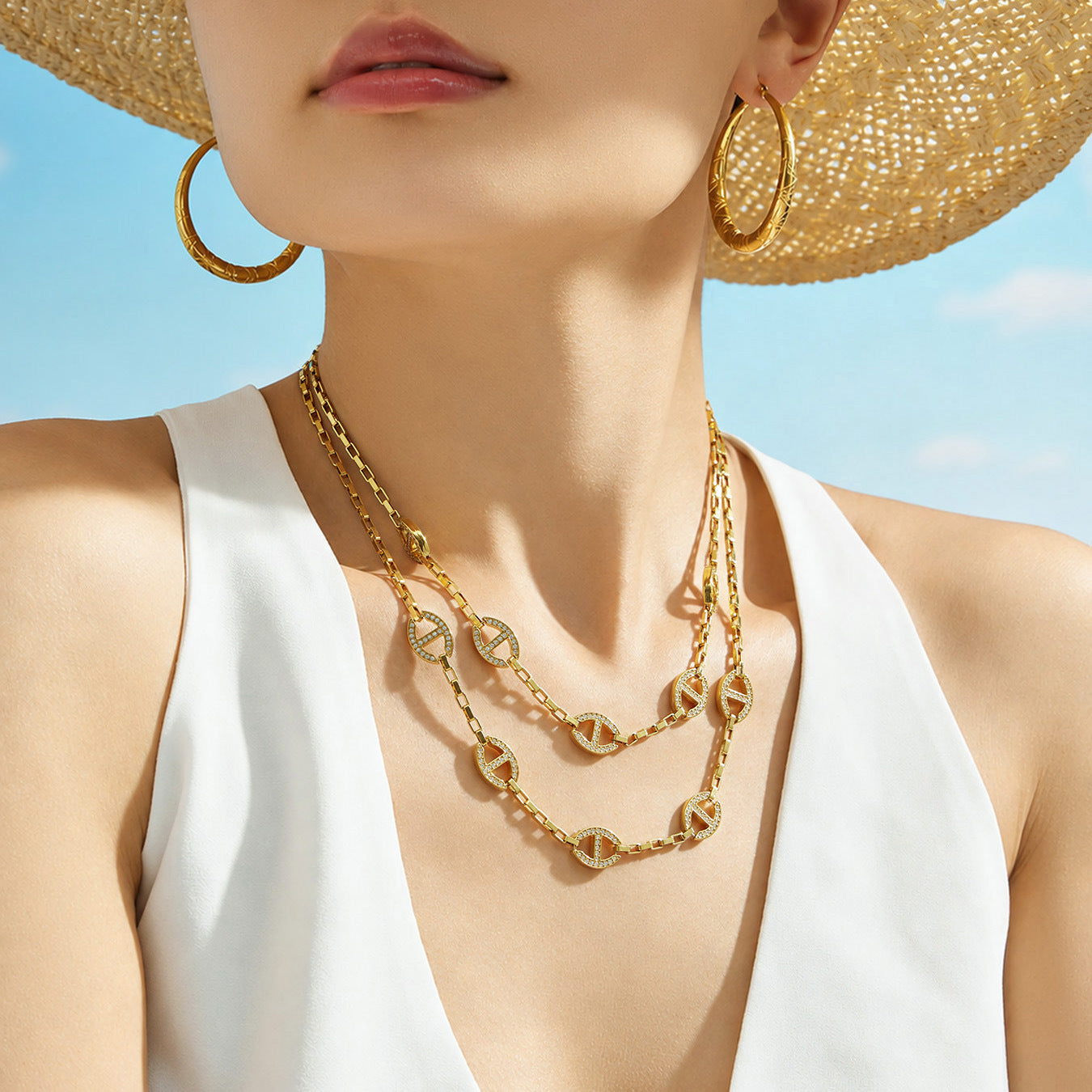 Close-up of model wearing gold D-shaped zircon necklace in 18K PVD stainless steel
