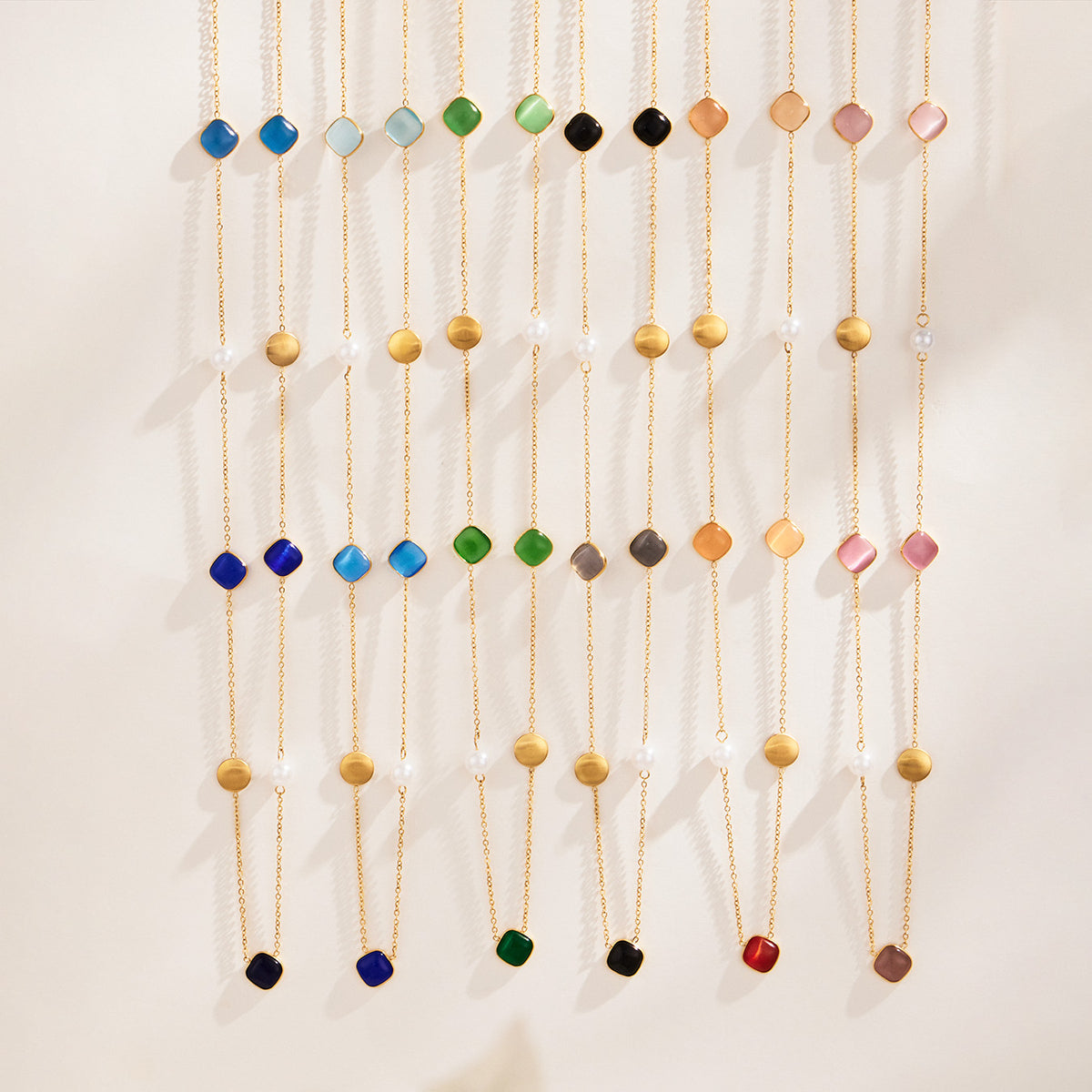 Multicolor cat eye bead long necklace collection displayed in blue, green, black, pink and warm tones