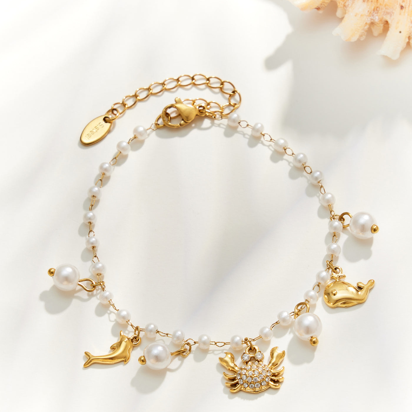 Gold crab ocean charm pearl bracelet with marine animal charms and pearl bead accents