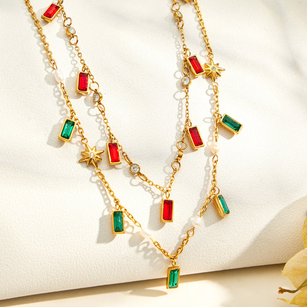 Detail display of colorful glass stone charm necklaces with green and red pendant accents