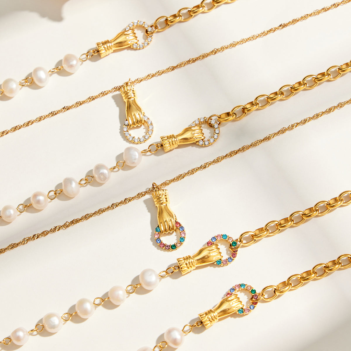 Freshwater pearl and zircon chain necklace styles displayed in white and multicolor designs