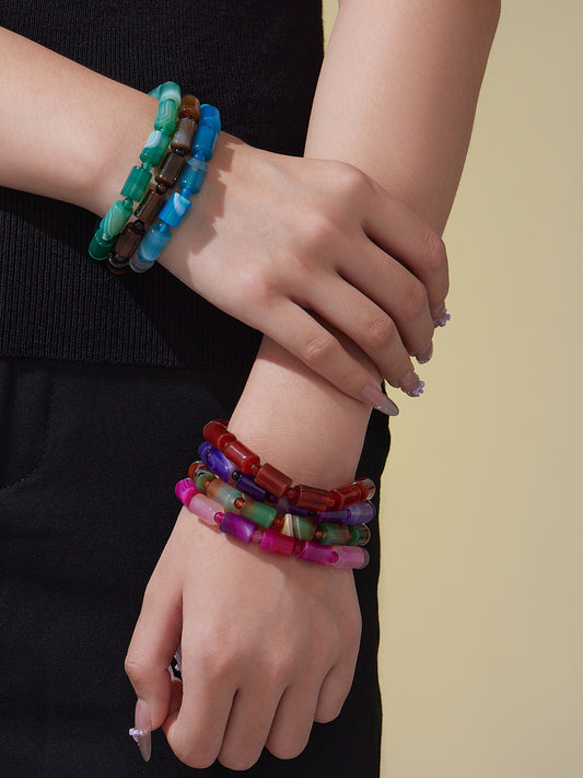 Model wearing 316L Stainless Steel natural stone stretch bracelet, multi-color gradient, hypoallergenic