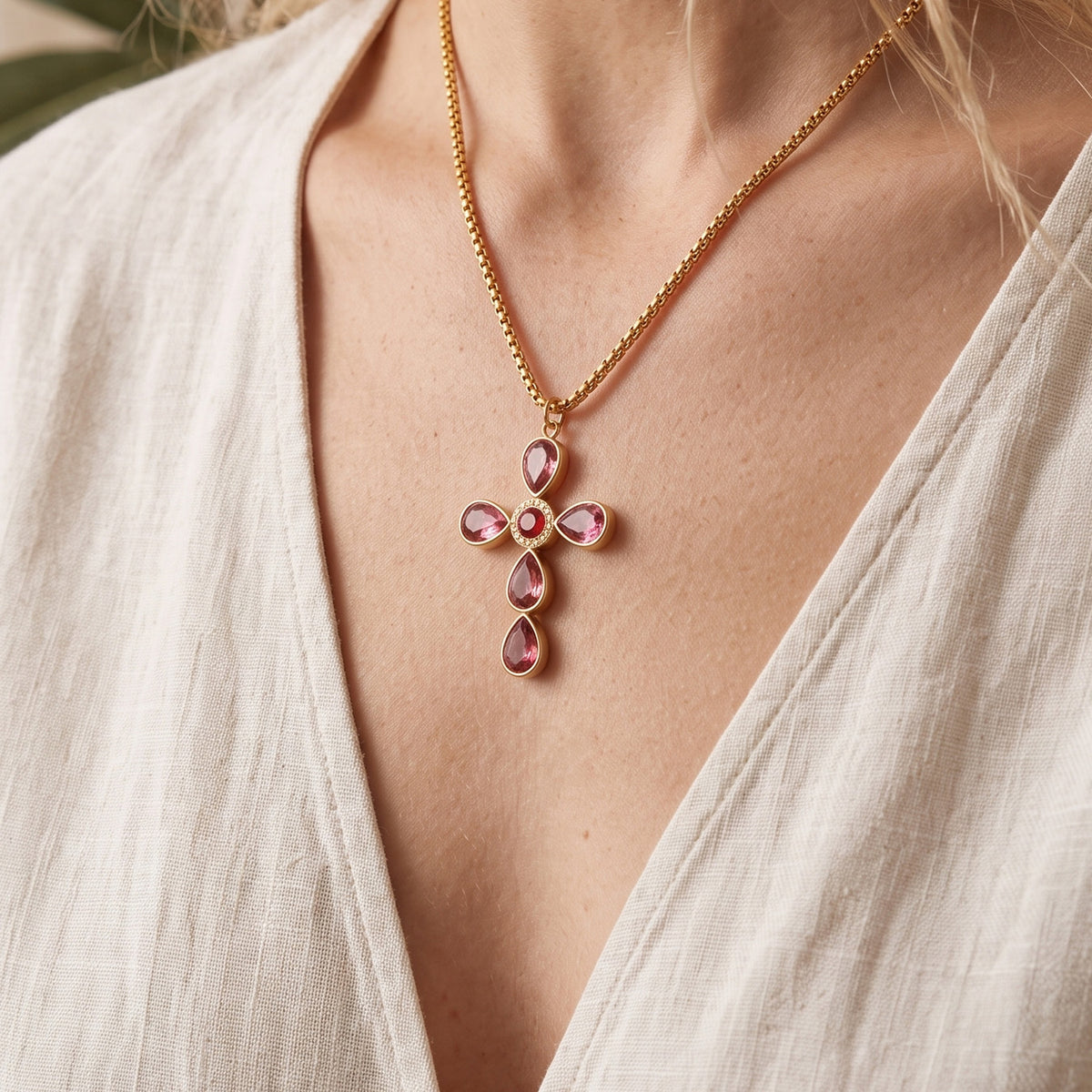 Purple stone cross necklace worn on model